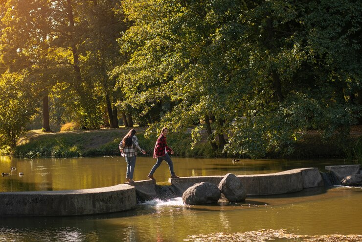 long-shot-cute-couple-walking-nature_23-2149884226